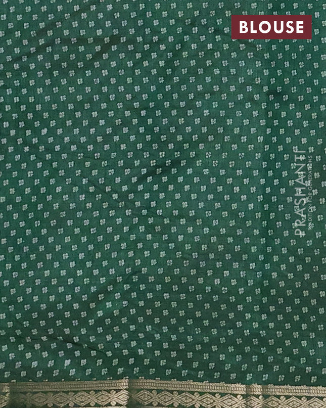 Semi raw silk saree bottle green with allover butta prints and zari woven border
