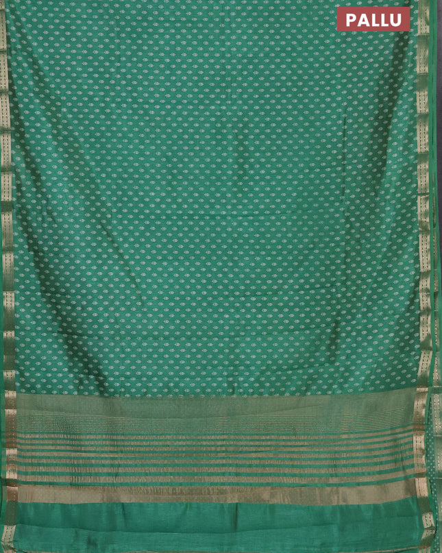 Semi raw silk saree teal green with allover butta prints and zari woven border
