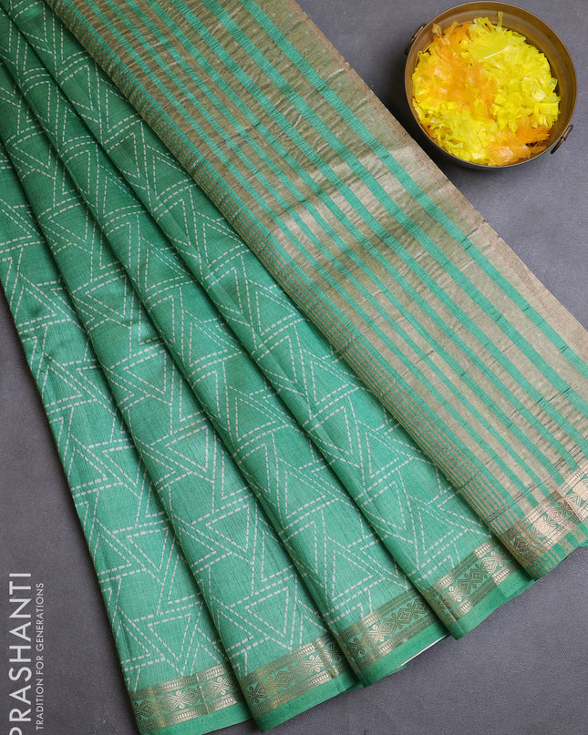 Semi raw silk saree teal green with allover geometric prints and zari woven border