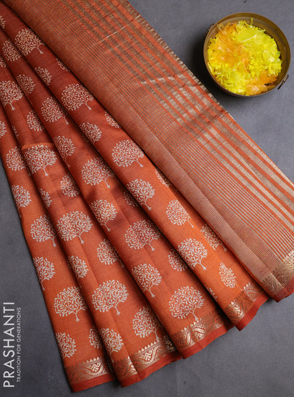 Semi raw silk saree rustic orange with allover butta prints and zari woven border