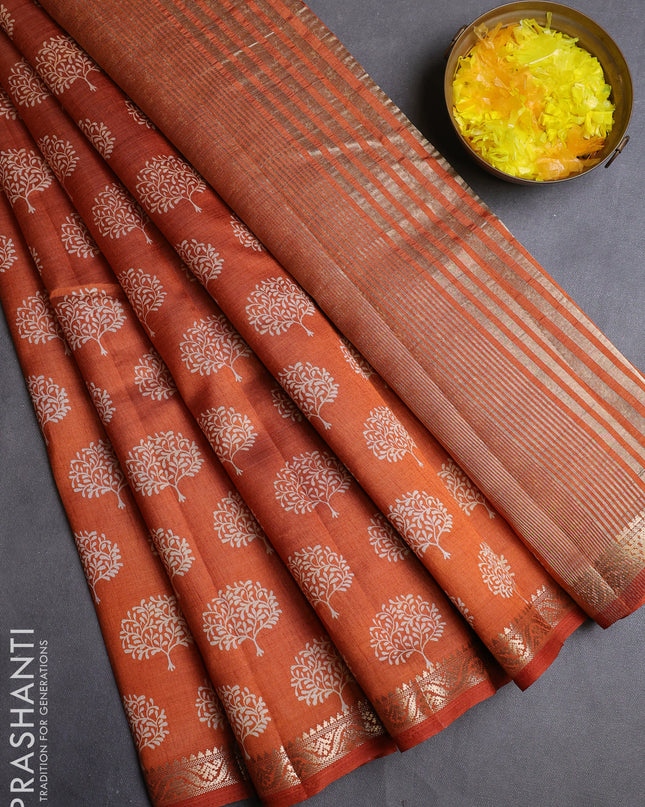Semi raw silk saree rustic orange with allover butta prints and zari woven border