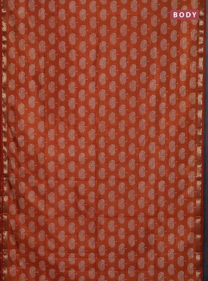 Semi raw silk saree rustic orange with allover butta prints and zari woven border