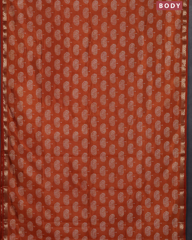 Semi raw silk saree rustic orange with allover butta prints and zari woven border