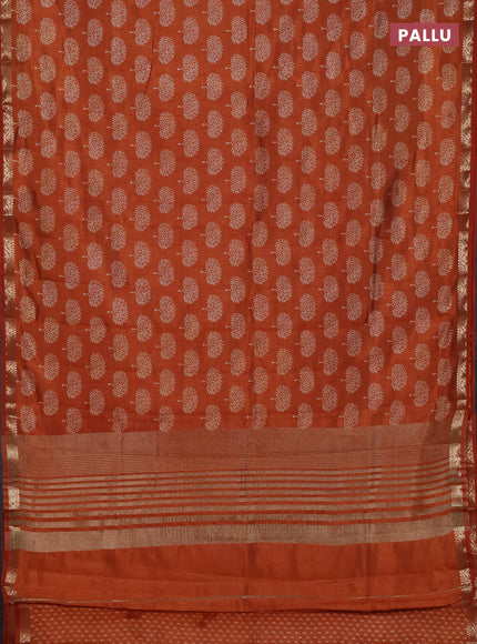 Semi raw silk saree rustic orange with allover butta prints and zari woven border