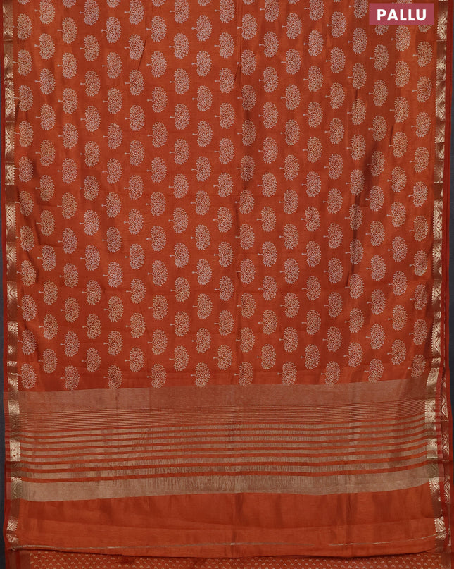 Semi raw silk saree rustic orange with allover butta prints and zari woven border