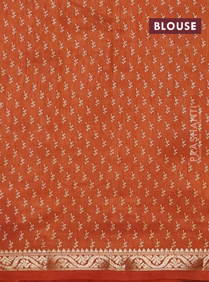 Semi raw silk saree rustic orange with allover butta prints and zari woven border