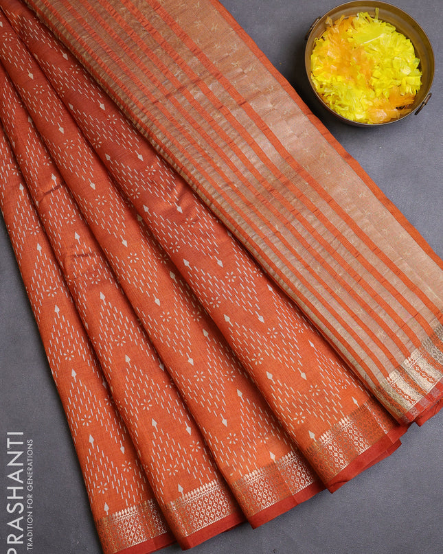 Semi raw silk saree rustic orange with allover zig zag prints and zari woven border