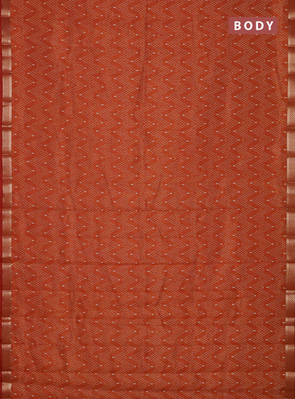Semi raw silk saree rustic orange with allover zig zag prints and zari woven border