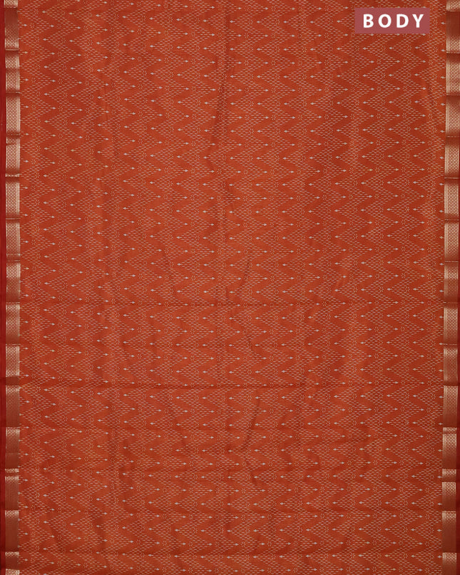 Semi raw silk saree rustic orange with allover zig zag prints and zari woven border