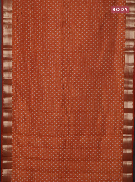 Semi raw silk saree rustic orange with allover butta prints and zari woven border