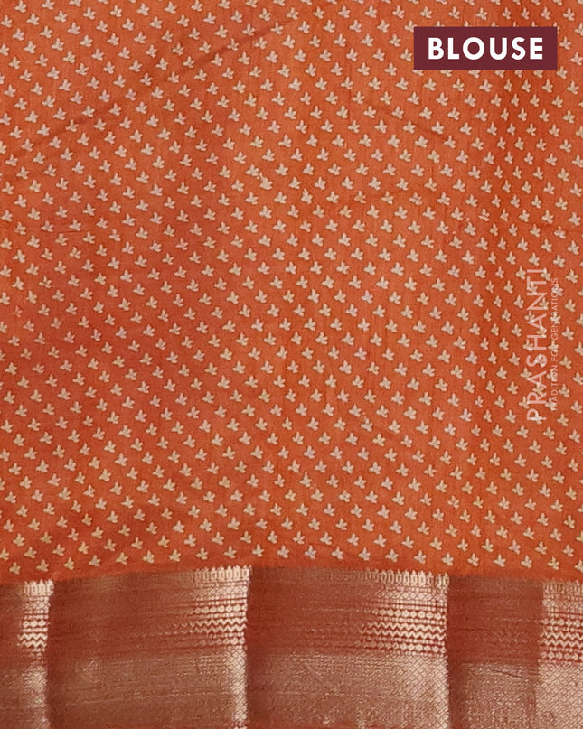 Semi raw silk saree rustic orange with allover butta prints and zari woven border