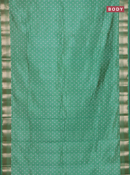 Semi raw silk saree teal green with allover butta prints and zari woven border
