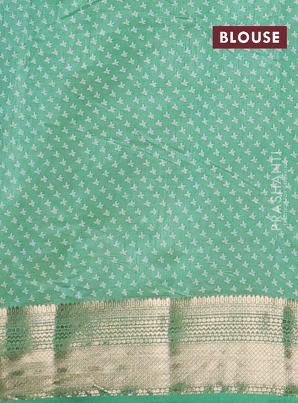 Semi raw silk saree teal green with allover butta prints and zari woven border