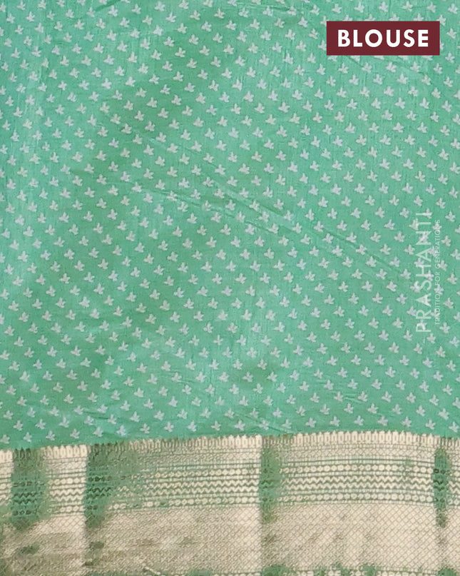 Semi raw silk saree teal green with allover butta prints and zari woven border