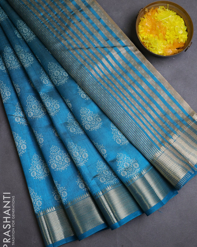 Semi raw silk saree cs blue with allover butta prints and zari woven border