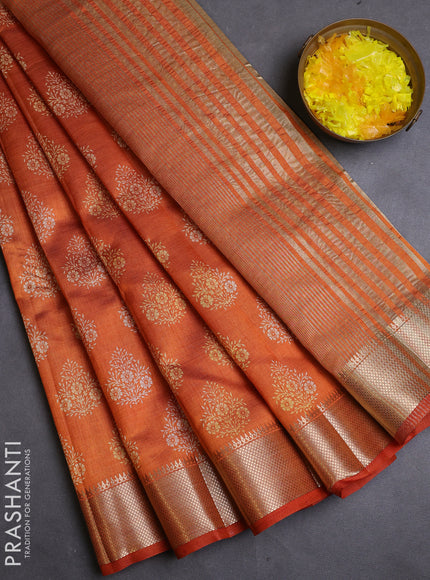 Semi raw silk saree rustic orange with allover butta prints and zari woven border
