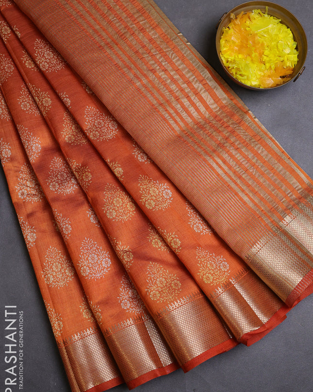 Semi raw silk saree rustic orange with allover butta prints and zari woven border