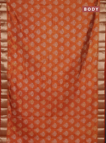 Semi raw silk saree rustic orange with allover butta prints and zari woven border