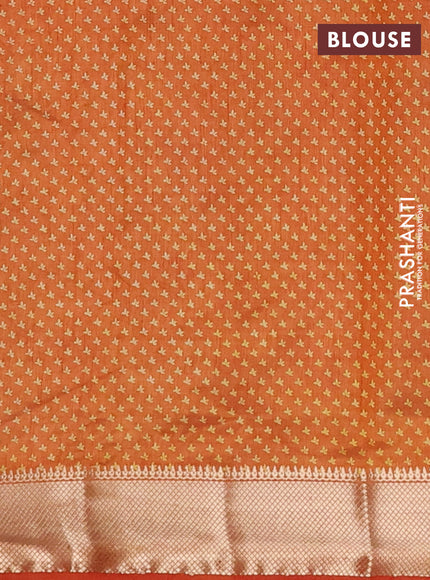 Semi raw silk saree rustic orange with allover butta prints and zari woven border