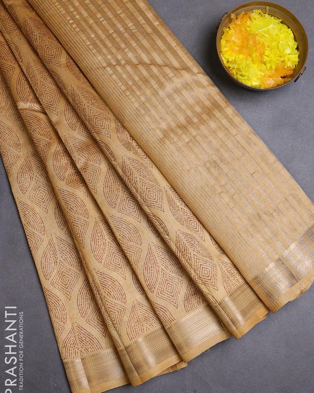 Semi raw silk saree sandal with allover butta prints and zari woven border