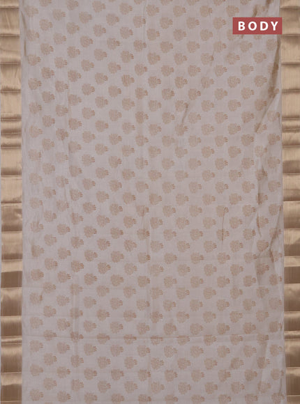 Semi raw silk saree cream with allover butta prints and zari woven border