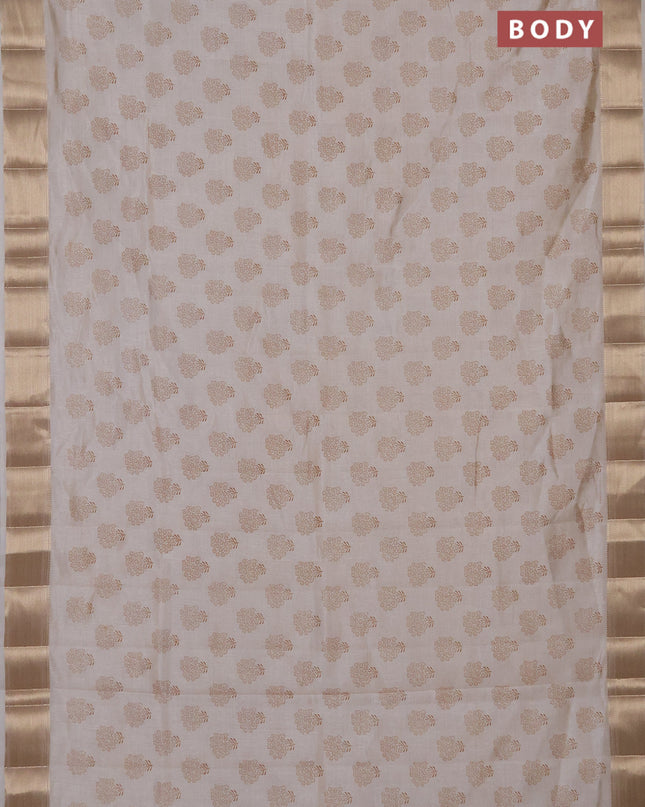 Semi raw silk saree cream with allover butta prints and zari woven border