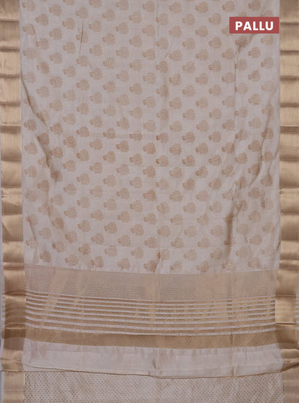 Semi raw silk saree cream with allover butta prints and zari woven border