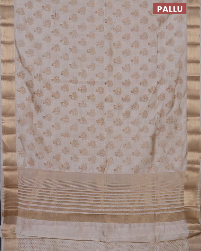 Semi raw silk saree cream with allover butta prints and zari woven border