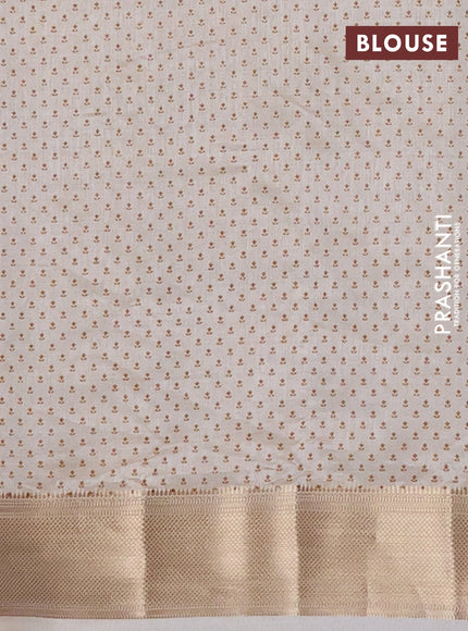 Semi raw silk saree cream with allover butta prints and zari woven border