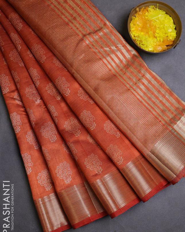 Semi raw silk saree rustic orange with allover butta prints and zari woven border
