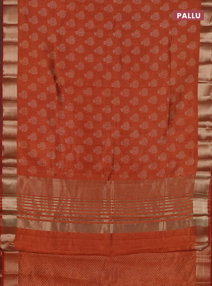 Semi raw silk saree rustic orange with allover butta prints and zari woven border