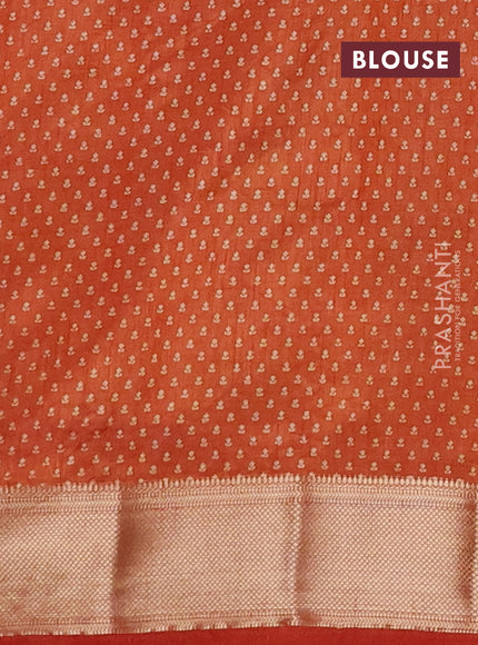 Semi raw silk saree rustic orange with allover butta prints and zari woven border