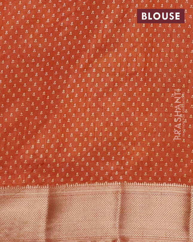 Semi raw silk saree rustic orange with allover butta prints and zari woven border