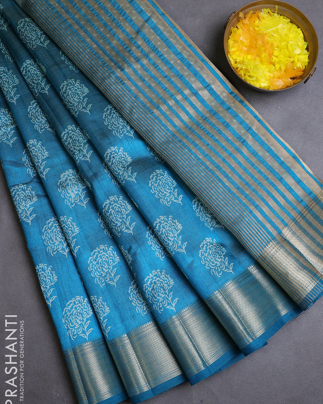 Semi raw silk saree peacock blue with allover floral butta prints and zari woven border