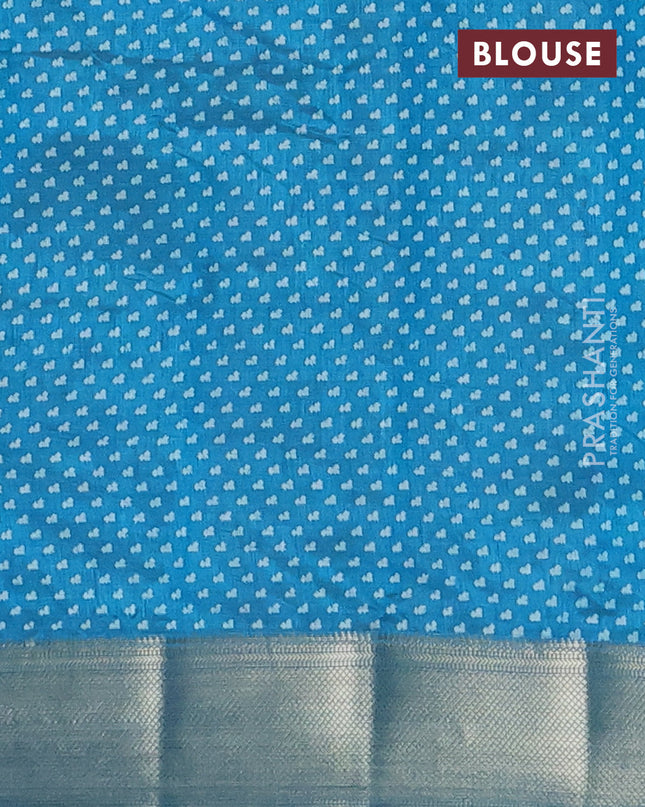 Semi raw silk saree peacock blue with allover floral butta prints and zari woven border