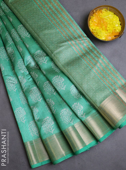 Semi raw silk saree teal green with allover floral butta prints and zari woven border