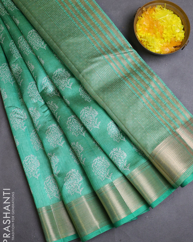Semi raw silk saree teal green with allover floral butta prints and zari woven border