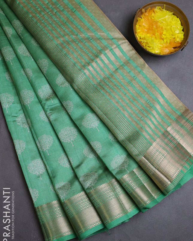 Semi raw silk saree teal green with allover butta prints and zari woven border
