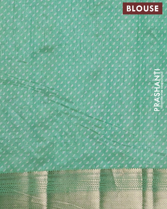 Semi raw silk saree teal green with allover butta prints and zari woven border