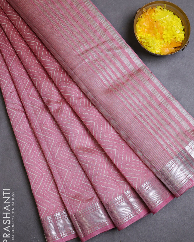 Semi raw silk saree pastel pink with allover zig zag prints and zari woven border