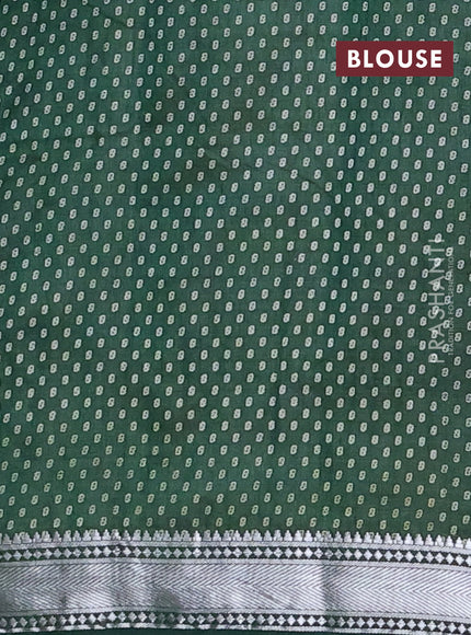 Semi raw silk saree bottle green with allover leaf butta prints and zari woven border