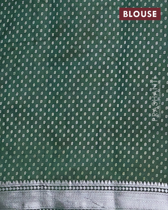 Semi raw silk saree bottle green with allover leaf butta prints and zari woven border