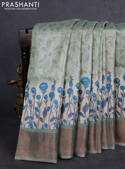 Pure tussar silk saree pastel green and cream with allover floral prints and zari woven border