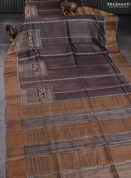 Pure tussar silk saree brown and pastel brown with allover prints and zari woven border