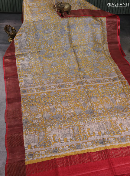 Pure tussar silk saree yellow and red with allover kalamkari prints and zari woven border