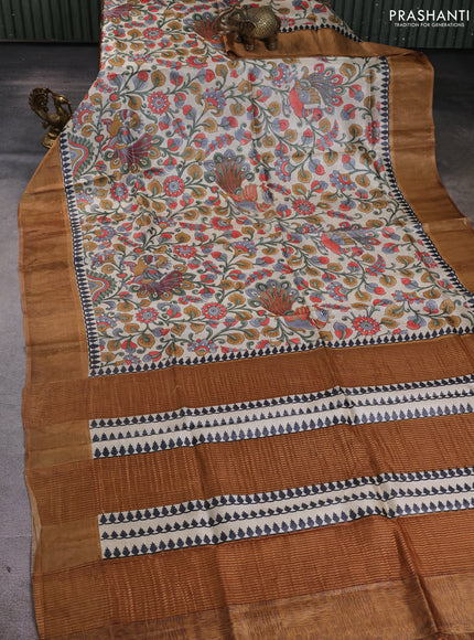 Pure tussar silk saree cream and dark sandal with allover kalamkari prints and zari woven border