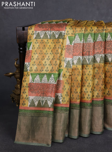 Pure tussar silk saree multi colour and pastel green with allover prints and zari woven border