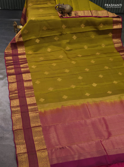 Kanchipuram silk saree mehendi green and magenta pink with allover zari woven buttas and long rich zari woven border
