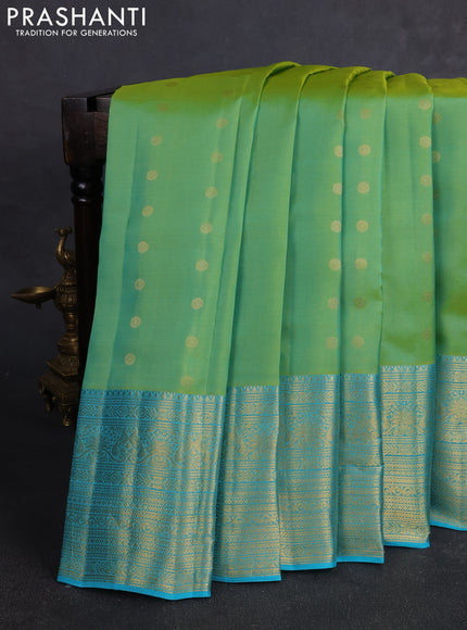 Kanchipuram silk saree light green and teal blue with allover zari woven buttas and long rich zari woven border
