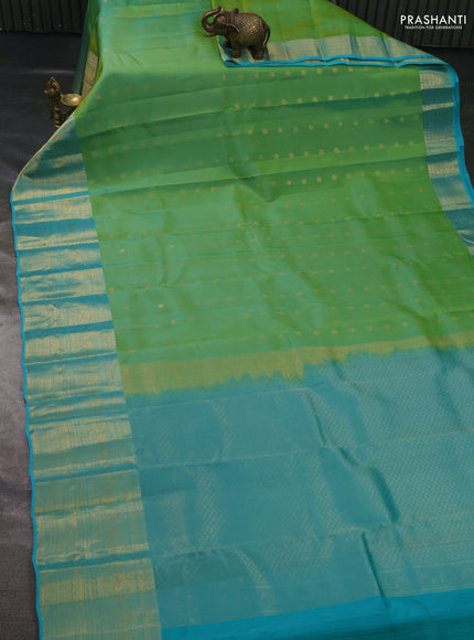 Kanchipuram silk saree light green and teal blue with allover zari woven buttas and long rich zari woven border